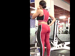 mixed girl with big bum in latex at the gym