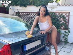 Lady with massive saggy jugs Helen Star is washing a car