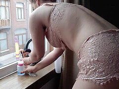 Maid tidying up the flat in lingerie