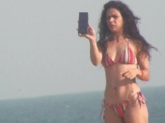 Hispanic fitness girl on the beach voyeur clip