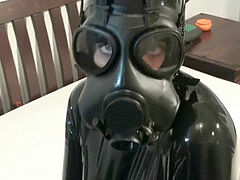 dame In 2 Layers Of latex Catsuits dark-hued + Transparent With Gas Mask + Piss