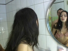 Long-haired teen named Karina sucks hard dick and gets screwed in the bathroom