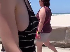 Exhibitionist female shows knockers and cunny at the beach