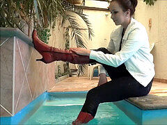 female play in pool in jacket and shoes