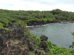 Emily enjoys a day out in the caves, and black sand beach.