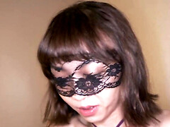 Asian babe Roxie wears a mask and feasts on a dick