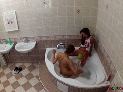 Lesbians Wash Each Other's Wet Pussies In The Bathtub