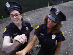 Two lady cops are having a threesome with a large black dude