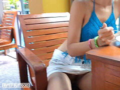 woman with red hair sits pantyless in a public dining room